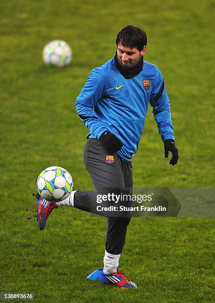 Lionel Messi of FC Barcelona controls a ball during training at the BayArena on February 13, 2012 in Leverkusen, Germany.