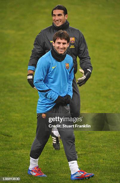 Lionel Messi and José Manuel Pinto of FC Barcelona look happy during training at the BayArena on February 13, 2012 in Leverkusen, Germany.