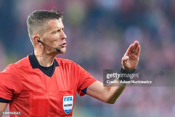Referee Daniele Orsato from Italy gestures during the 2022 FIFA World Cup Qualifier knockout round play-off match between Poland and Sweden at...