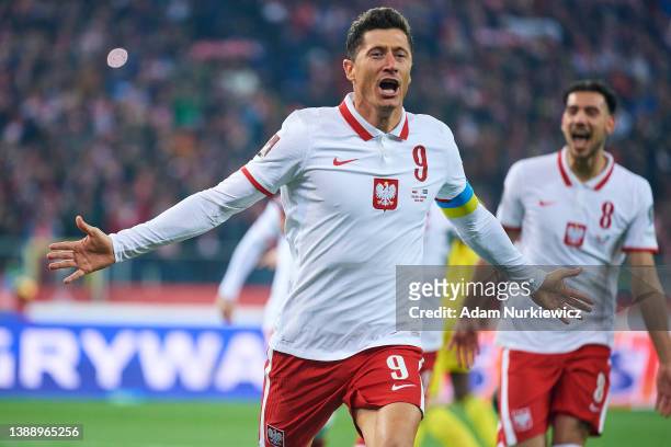 Robert Lewandowski from Poland celebrates with team mates after scoring during the 2022 FIFA World Cup Qualifier knockout round play-off match...
