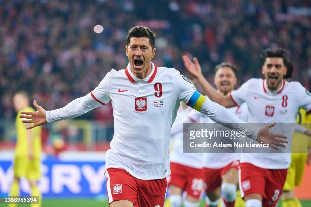 Robert Lewandowski from Poland celebrates with team mates after scoring during the 2022 FIFA World Cup Qualifier knockout round play-off match...