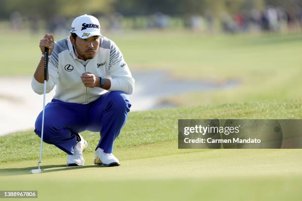 Hideki Matsuyama of Japan lines up a putt on the 14th green during the second round of the Valero Texas Open at TPC San Antonio on April 01, 2022 in...