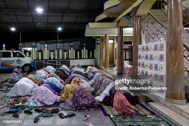 Indonesian Muslims Muhammadiyah perform the first Tarawih, marking the beginning of Ramadan at Baiturrahman mosque on April 01, 2022 in Surabaya,...