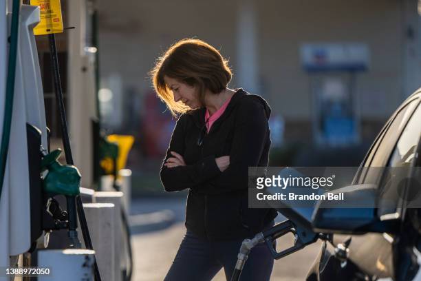 Person pumps gas at a Shell gas station on April 01, 2022 in Houston, Texas. The Biden administration announced Thursday that the U.S. Will release...