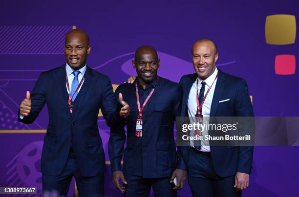 Didier Drogba, Geremi and Mikael Silvestor arrive prior to the FIFA World Cup Qatar 2022 Final Draw at the Doha Exhibition Center on April 01, 2022...