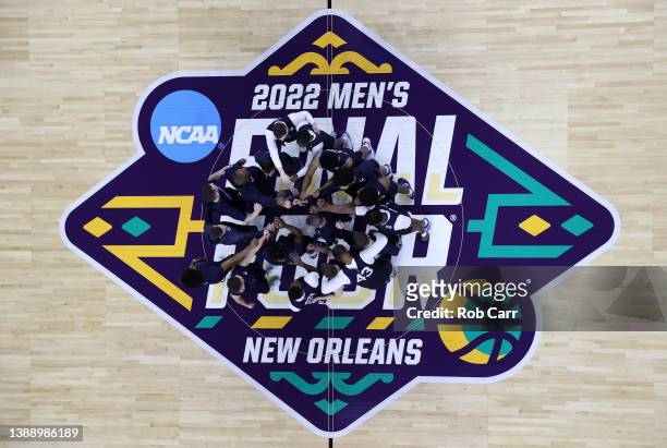 Villanova Wildcats players and coaches huddle in the center of the court during practice before the 2022 Men's Basketball Tournament Final Four at...