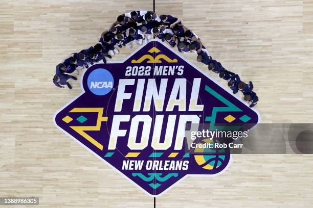 Villanova Wildcats players and coaches pose for photos in the center of the court during practice before the 2022 Men's Basketball Tournament Final...