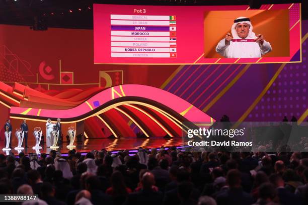 General view as Adel Ahmed Mallala draws the card of Japan in Group E during the FIFA World Cup Qatar 2022 Final Draw at the Doha Exhibition Center...