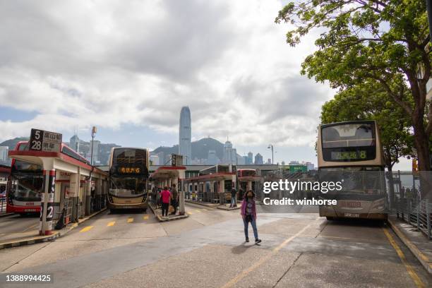 tsim sha tsui star ferry bus terminus in kowloon, hong kong - tsim sha tsui stock pictures, royalty-free photos & images