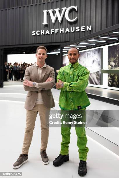 Chris Grainger-Herr, IWC Schaffhausen CEO, and Lewis Hamilton pose at the IWC Schaffhausen booth at Watches and Wonders 2022 on April 01, 2022 in...