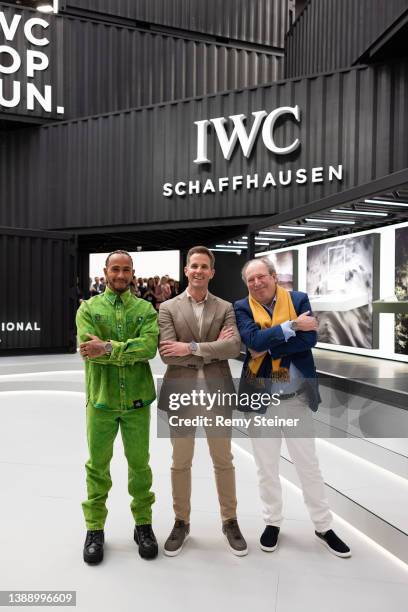 Chris Grainger-Herr, CEO IWC Schaffhausen, Lewis Hamilton and Hans Zimmer pose during the Meet & Greet at the IWC Schaffhausen booth at Watches and...