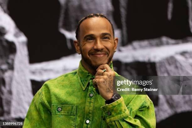Lewis Hamilton poses during the Signature talk “Being a Pilot” with Valentino Rossi at the IWC Schaffhausen booth at Watches and Wonders 2022 on...