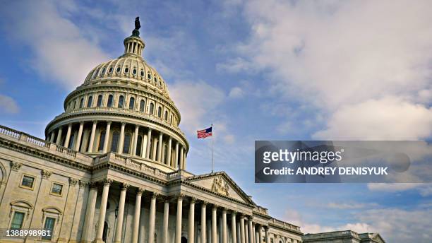 united states capitol. day. flag. - congress stock pictures, royalty-free photos & images