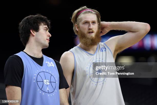 Duwe Farris and Brady Manek of the North Carolina Tar Heels talk during practice before the 2022 Men's Basketball Tournament Final Four at Caesars...