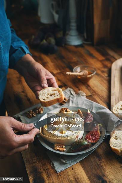 baked camembert cheese with fresh figs - baked brie stock pictures, royalty-free photos & images