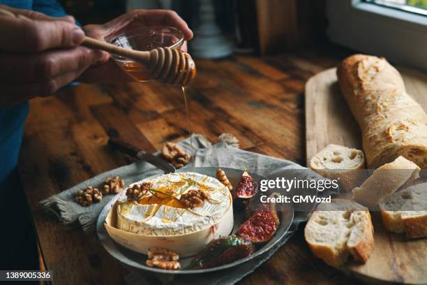 baked camembert cheese with fresh figs - baguette stock pictures, royalty-free photos & images