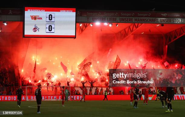 Fans of 1.FC Koeln light flares in the stands during the Bundesliga match between 1. FC Union Berlin and 1. FC Köln at Stadion An der Alten...