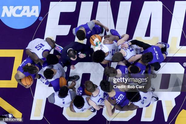 Head coach Mike Krzyzewski of the Duke Blue Devils talks with players during practice before the 2022 Men's Basketball Tournament Final Four at...