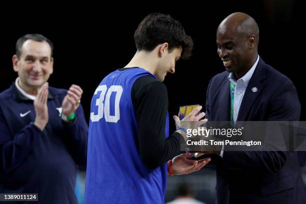 Michael Savarino of the Duke Blue Devils is presented with an award during practice before the 2022 Men's Basketball Tournament Final Four at Caesars...