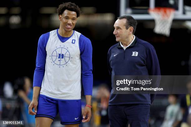 Head coach Mike Krzyzewski of the Duke Blue Devils talks to player Wendell Moore Jr. #0 during practice before the 2022 Men's Basketball Tournament...