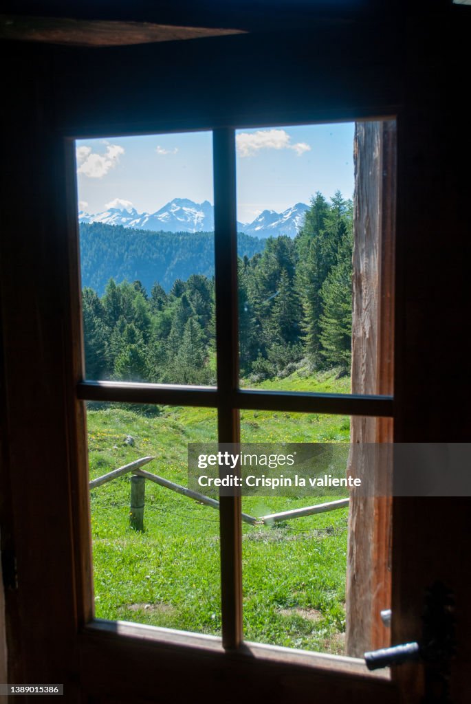 Alpine landscape from inside a mountain hut