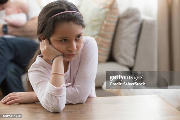 little girl jealous of her baby brother - jealous child stock pictures, royalty-free photos & images