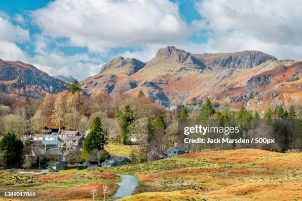 elterwater commons,scenic view of landscape and mountains against sky,elterwater,ambleside,united kingdom,uk - lake district autumn stockfoto's en -beelden