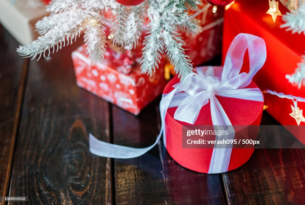 Christmas gift boxes under the tree,On the wooden floor