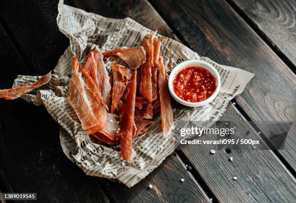 dried chicken,dried poultry,cut into strips on parchment - trockenfleisch stock-fotos und bilder