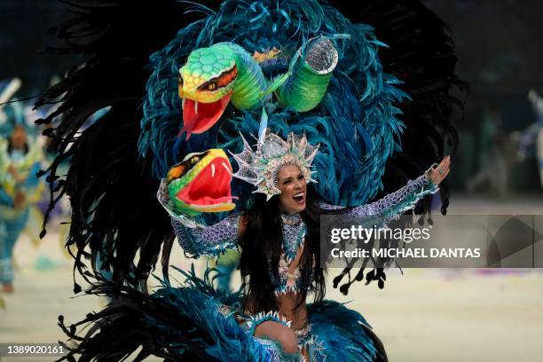 An artist of Caprichoso Cultural Association performs during the annual folklore festival known as Boi Bumba at Bumbodromo, in Parintins, an island...