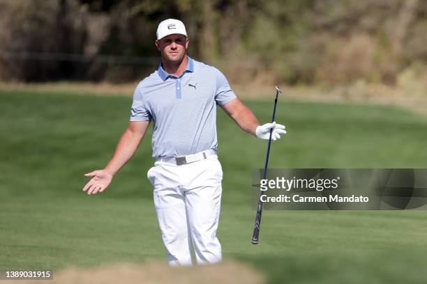 Bryson DeChambeau reacts to his shot on the 14th hole during the second round of the Valero Texas Open at TPC San Antonio on April 01, 2022 in San...
