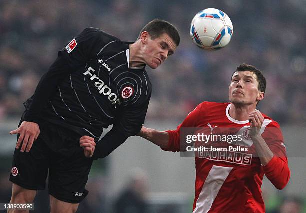 Oliver Fink of Duesseldorf and Sebastian Jung of Frankfurt battle for the ball during the Second Bundesliga match between Fortuna Duesseldorf and...