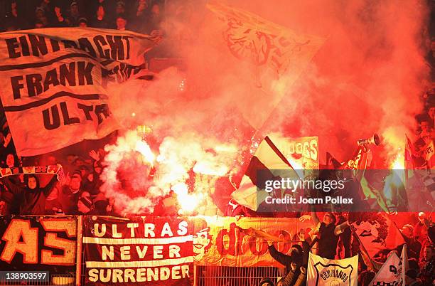 Fans of Frankfurt burning flares during the Second Bundesliga match between Fortuna Duesseldorf and Eintracht Frankfurt on February 13, 2012 in...