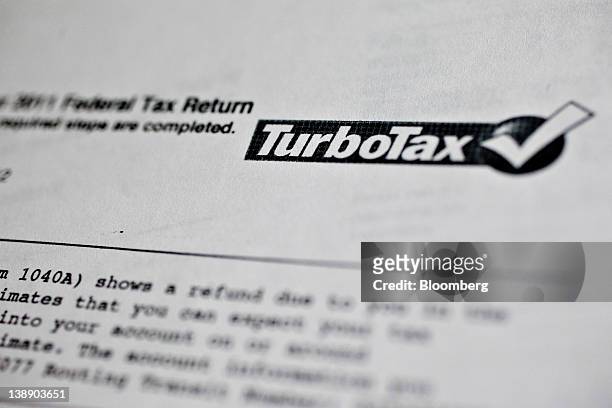 Federal tax return forms printed after using Intuit Inc.ís TurboTax online service are arranged for a photograph in Washington, D.C., U.S., on...