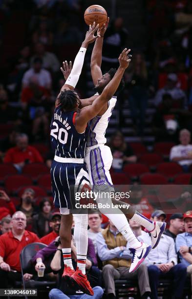 Damian Jones of the Sacramento Kings shoots over Bruno Fernando of the Houston Rockets during the second quarter at Toyota Center on April 01, 2022...