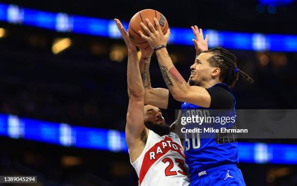 Markelle Fultz of the Orlando Magic drives on Fred VanVleet of the Toronto Raptors during a game at Amway Center on April 01, 2022 in Orlando,...