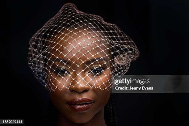 Yaya Deng, wearing a netting headpiece looks on during The Star Championships Day 1 at Royal Randwick Racecourse on April 02, 2022 in Sydney,...