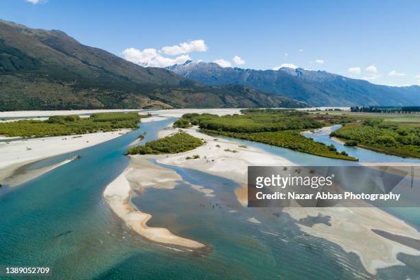mountain scenery and river flow. - braided river stock pictures, royalty-free photos & images