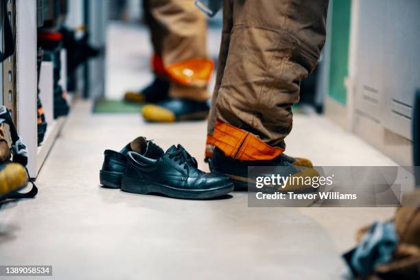 lower half of a firefighter after changing into the fire fighting equipment - 消防士　日本 ストックフォトと画像