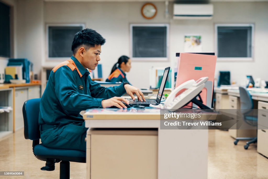 Firefighter working on a computer in the fire department office