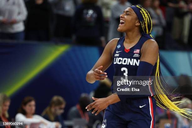 Aaliyah Edwards of the UConn Huskies reacts after defeating the Stanford Cardinal 63-58 during the 2022 NCAA Women's Final Four semifinal game at...