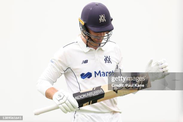 Peter Handscomb of Victoria walks from the field after being dismissed by Aaron Hardie of Western Australia during day three of the Sheffield Shield...