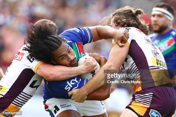 Bunty Afoa of the Warriors is tackled during the round four NRL match between the New Zealand Warriors and the Brisbane Broncos at Moreton Daily...