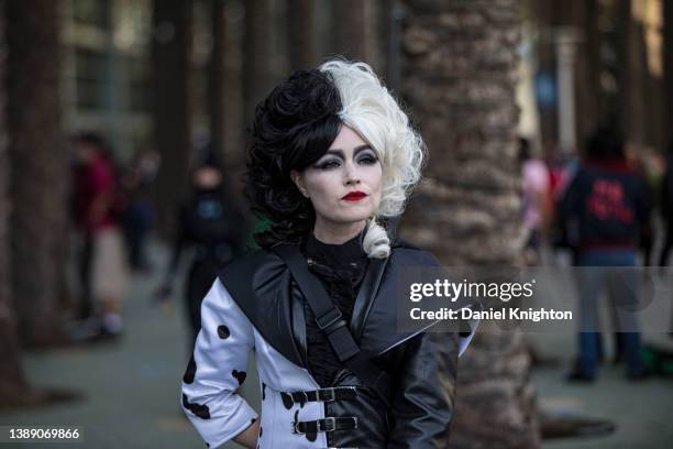 Cosplayer Ashton Gable as Cruella DeVil poses for photos at WonderCon 2022 Day 1 at Anaheim Convention Center on April 01, 2022 in Anaheim,...