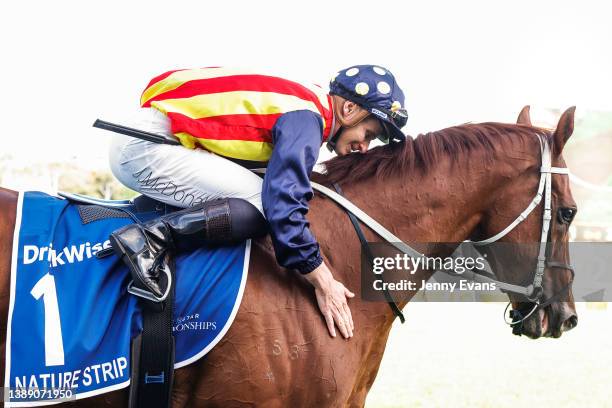 James McDonald pats Nature Strip after winning race 8 the Furphy TJ Smith Stakes during The Star Championships Day 1 at Royal Randwick Racecourse on...
