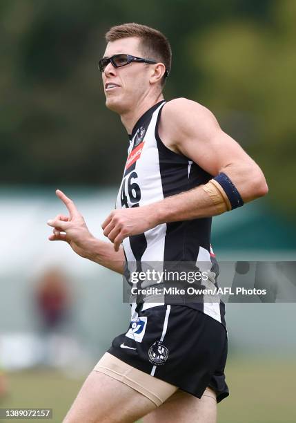 Mason Cox of the Magpies celebrates after kicking a goal during the round two VFL match between the Collingwood Magpies and the Geelong Cats at AIA...