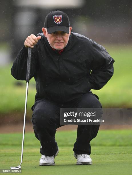 Roger Chapman of England lines up a putt during the continuation of the wether delayed first round of the MCB Tour Championship at Constance Belle...