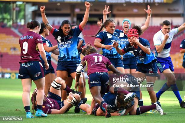 Melbourne Rebels celebrate as Willow Rowland scores a try during the round five Super W match between Queensland Reds and Melbourne Rebels at Suncorp...