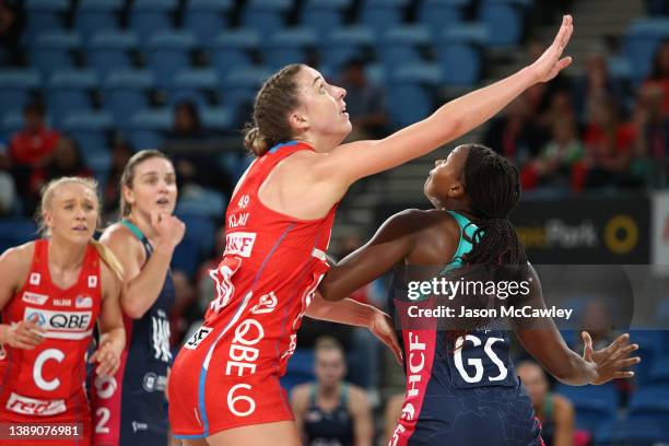 Mwai Kumwenda of the Vixens and Sarah Klau of the Swifts compete for the ball during the round two Super Netball match between Sydney Swifts and...