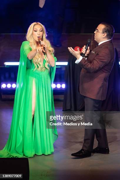 Special guest Yuri and Gilberto Santa Rosa perform during a concert at Auditorio Nacional on April 1, 2022 in Mexico City, Mexico.